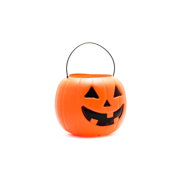 istock Studio shot Jack O' Lantern Halloween pumpkin pail isolated on white 866382616
