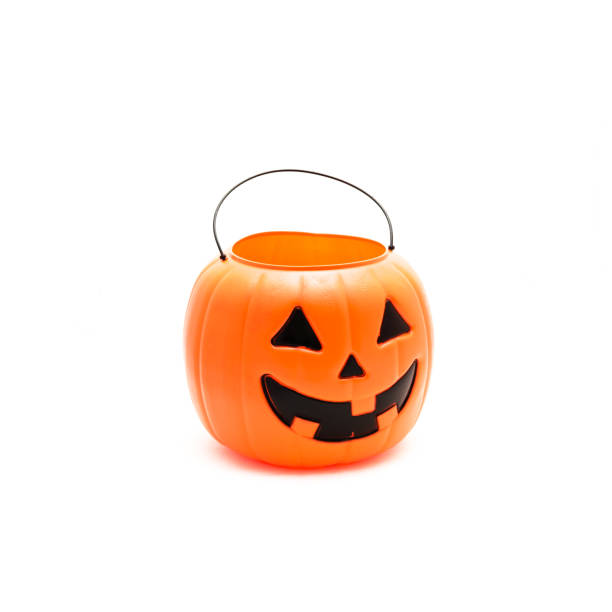 istock Studio shot Jack O' Lantern Halloween pumpkin pail isolated on white 866382694