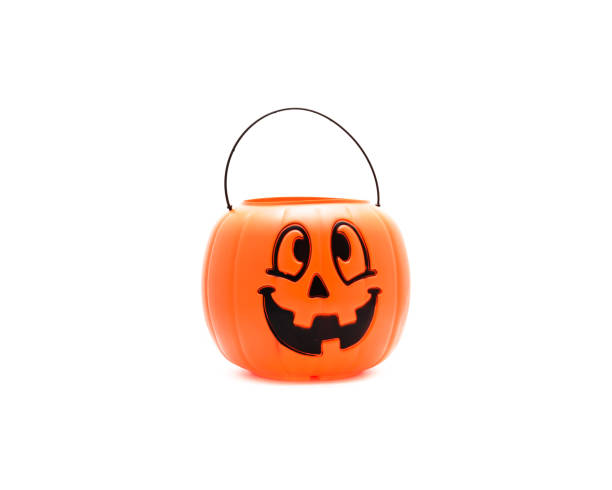 istock Studio shot Jack O' Lantern Halloween pumpkin pail isolated on white 866382746