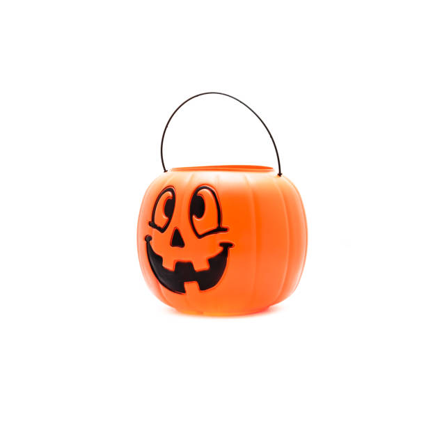 istock Studio shot Jack O' Lantern Halloween pumpkin pail isolated on white 866382770