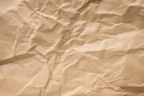 Crumpled craft paper texture Crumpled craft paper close up. Texture and background torn brown paper stock pictures, royalty-free photos & images