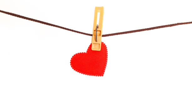 istock Red heart from dense fabric on a clothespeg on a rope 866389200