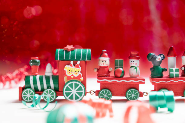 istock toy train on red bokeh background for christmas 866392050