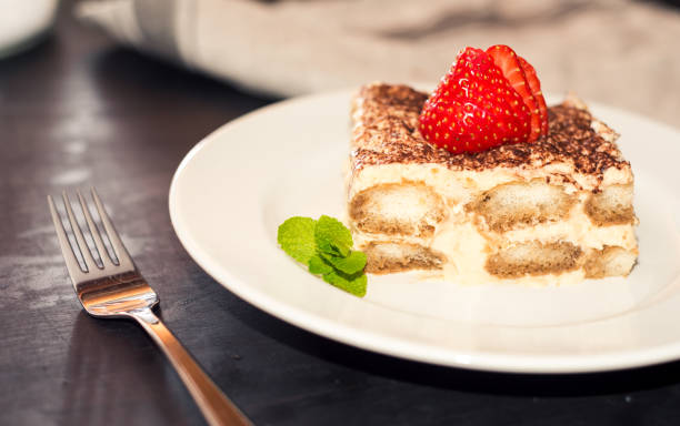 istock Tiramisu with strawberry on plate 866392126