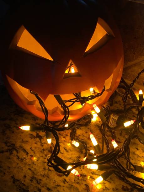 Vertical Spooky Evil Scary Jack O Lantern Halloween Pumpkin In The