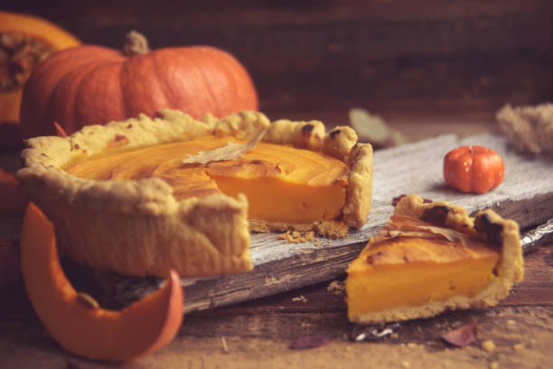 istock Homemade Pumpkin Pie with Autumn Decoration 866396506