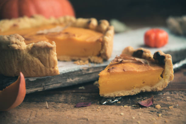 istock Homemade Pumpkin Pie with Autumn Decoration 866396534
