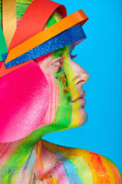 istock Model with colorful abstract makeup in multicolored helmet 866397582