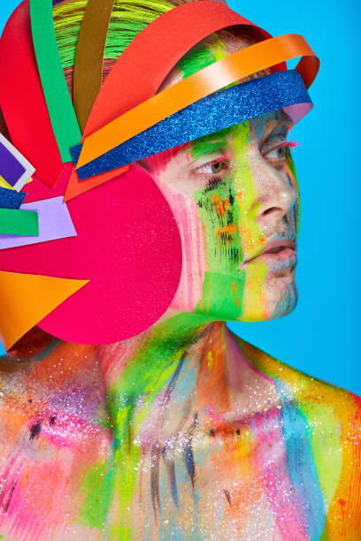 istock Model with colorful abstract makeup in multicolored helmet 866397698