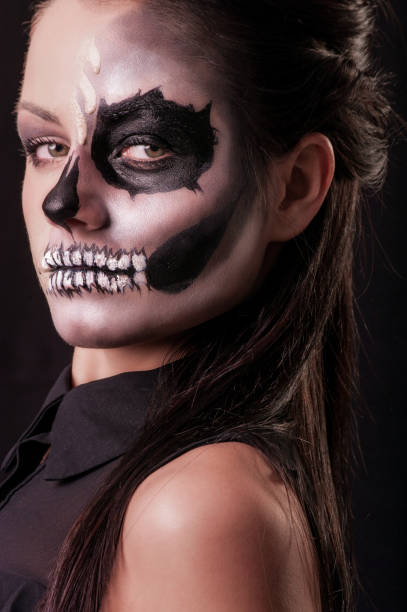 istock beautiful woman with make-up skeleton 866397882