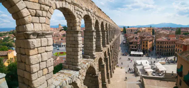 Looking across an extremely well-preserved span of Roman aqueduct in Segovia, Spain.  The elevated aqueduct was built in the 1st century AD (making it nearly 2000 years old), and is 15km long.
