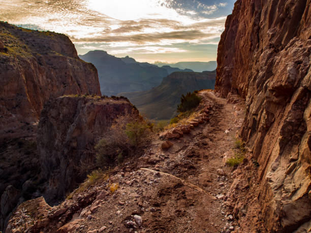 Cliff Edge Trail in the Grand Canyon A narrow section of the South Kaibab Trail in the Grand Canyon that skirts a cliff edge. south kaibab trail stock pictures, royalty-free photos & images