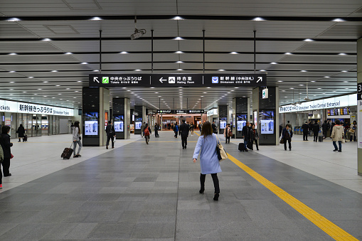Osaka, Japan - November 20, 2016: Passengers are walking along the hallway at JR Shin-Osaka station, Osaka, Japan