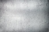 Silver metal background, steel sheet with a brush pattern