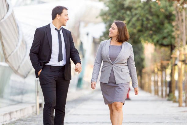 istock Two Happy Business Colleagues Walking on Street 866434266