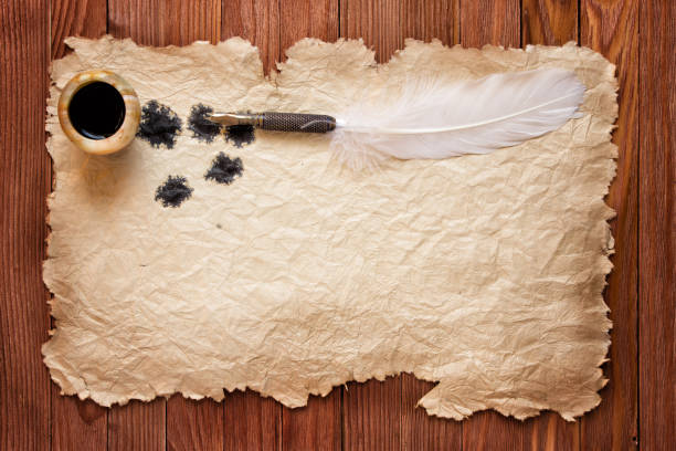 istock Inkwell and feather on a background  sheet of old paper 866441014