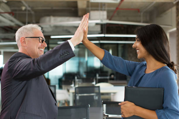 istock Positive successful business team giving five 866441184
