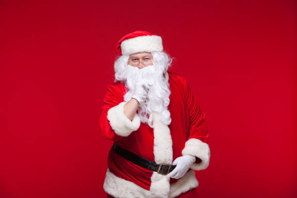 istock Santa Claus is dancing Isolated on red background 866444104