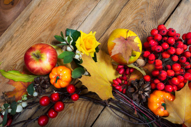 istock Thanksgiving pumpkins, berries, fall leaves wreath 866444520