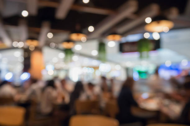 istock People in restaurant cafe interior with bokeh light blurred customer abstract background 866447750