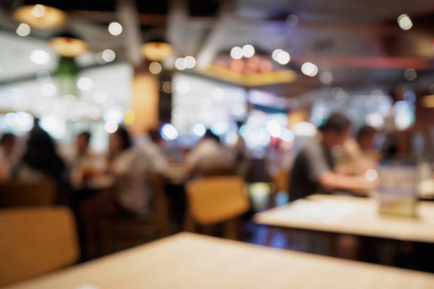 istock People in restaurant cafe interior with bokeh light blurred customer abstract background 866447758