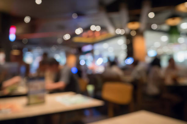 istock People in restaurant cafe interior with bokeh light blurred customer abstract background 866447760