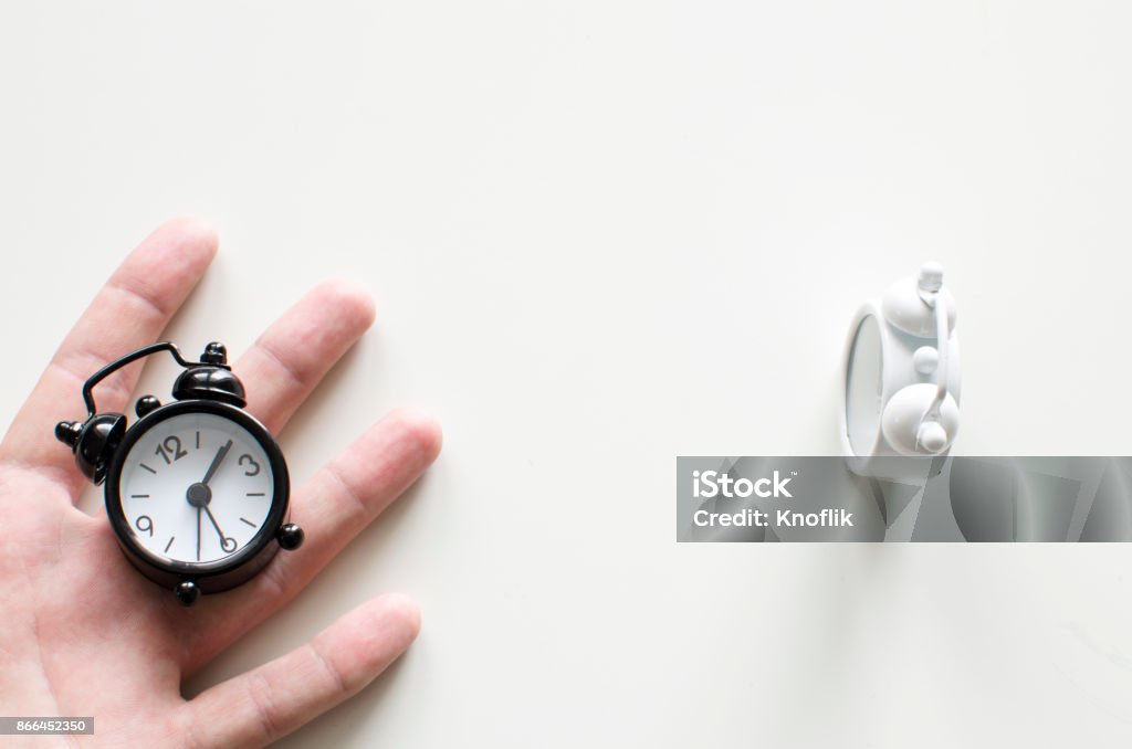 Alarm clock friends situation with hand Alarm Stock Photo
