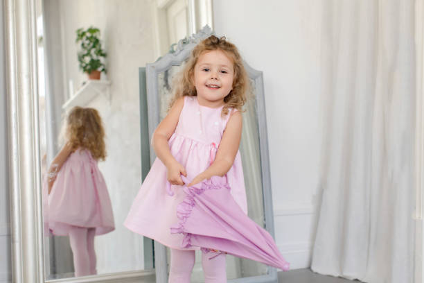 istock Adorable little girl with umbrella white interior 866464264