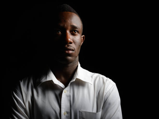 istock Young African businessman outdoors at night 866474586