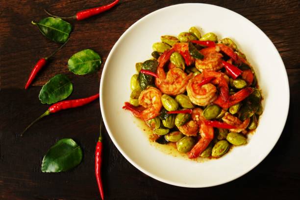 istock Stir Fried Twisted Cluster Bean with Shrimps,Bitter Bean. 866477664