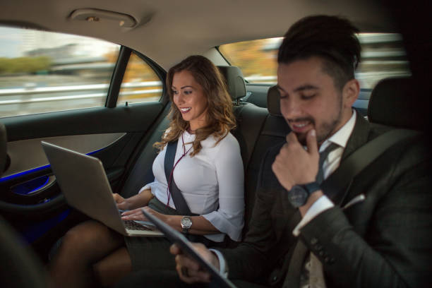 istock Business couple working in car 866483188