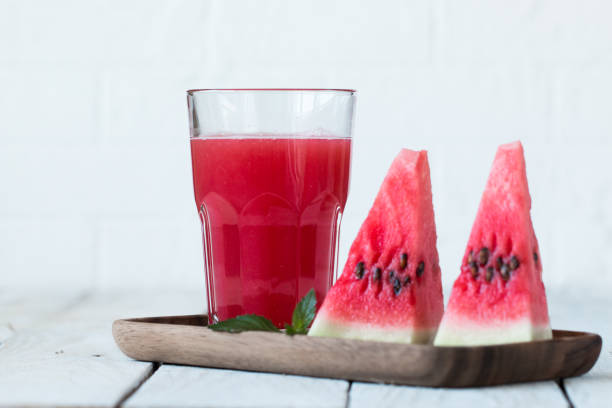 istock Healthy watermelon smoothie on a wood background 866483682