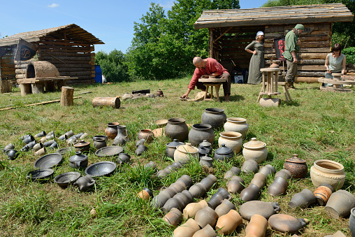 Kernave, Lithuania - July 7: Unidentified people make a jug at 14th International Festival of Experimental Archaeology on July 7, 2013. Its a most popular folklore event on July in Lithuania