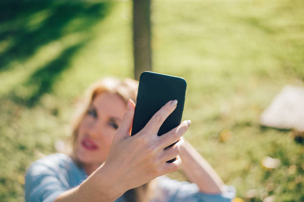 istock Woman taking selfie at city 866491374