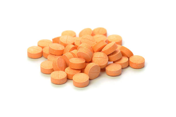 istock orange pills isolated on white background 866494092