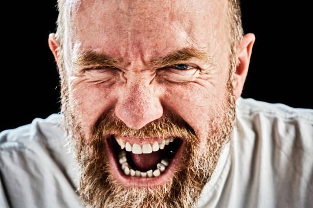 istock Mature bearded man roaring with happy laughter 866494144