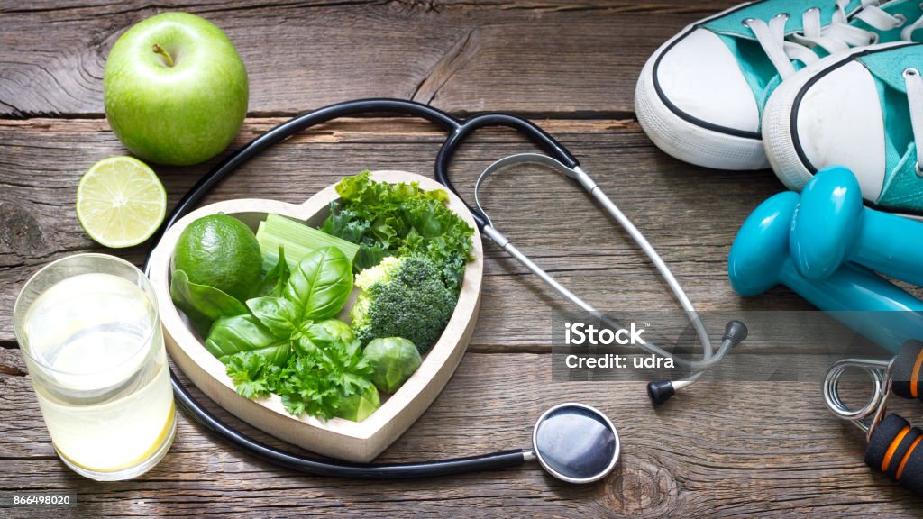 Green diet and sport healthy lifestyle concept Green diet and sport healthy lifestyle concept with heart Healthy Lifestyle Stock Photo