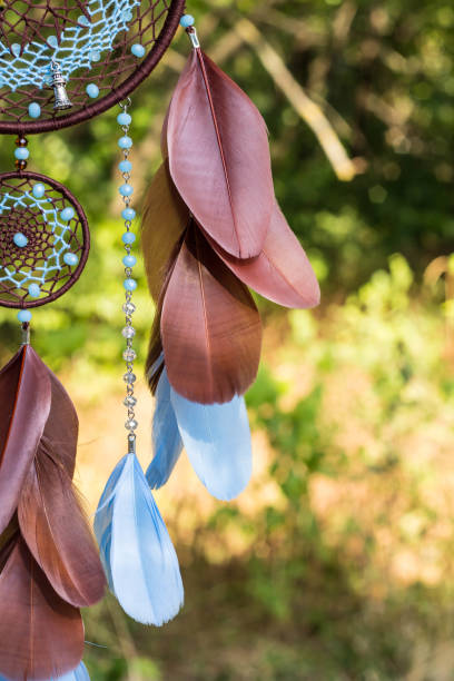 istock Handmade dream catcher with feathers threads and beads rope hanging 866498464