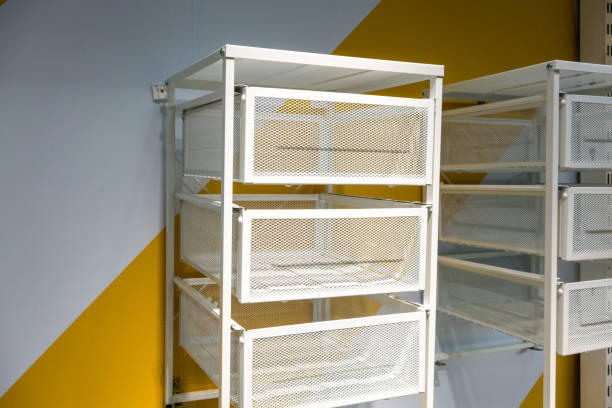 istock White metal drawer against white and yellow wall. 866498966