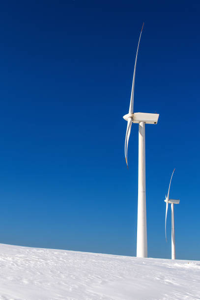 istock Wind turbine and blue sky in winter landscape. 866510196
