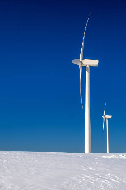 istock Wind turbine and blue sky in winter landscape. 866510400