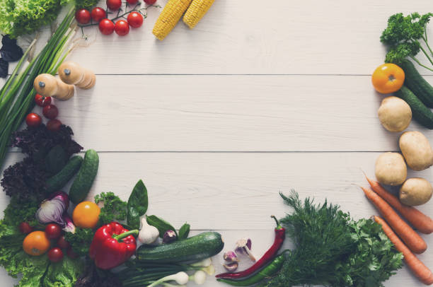 istock Fresh vegetables border on white wood background with copy space 866512944