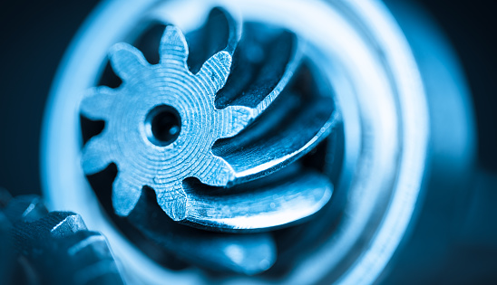 Abstract industrial background with cogwheels in blue color