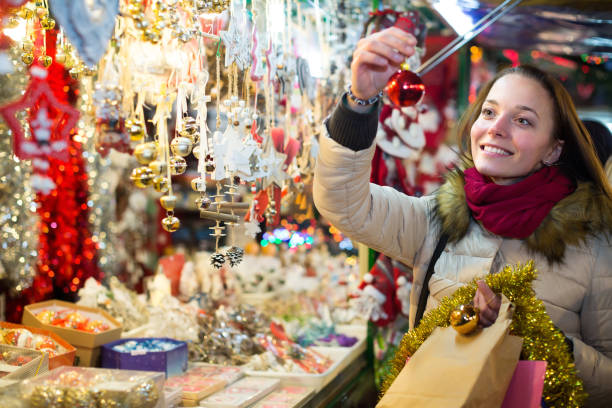 istock Woman at Christmas fair in evening 866514704