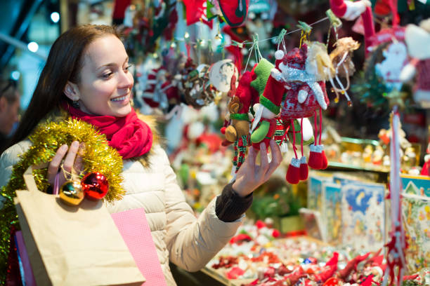 istock Woman at Christmas fair in evening 866514816