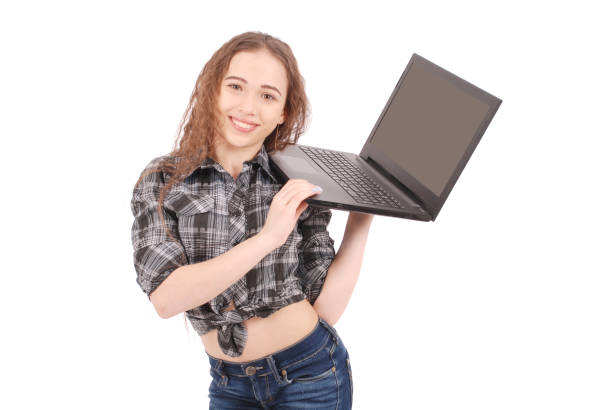 istock Young girl standing and using a laptop 866515036