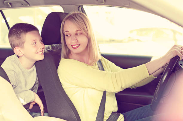 istock Woman and boy using car during sightseeing tour 866515228
