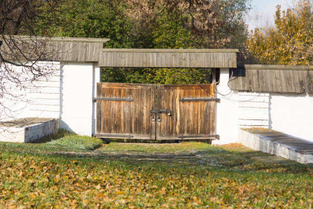 Ancient stone fence with wooden gates
