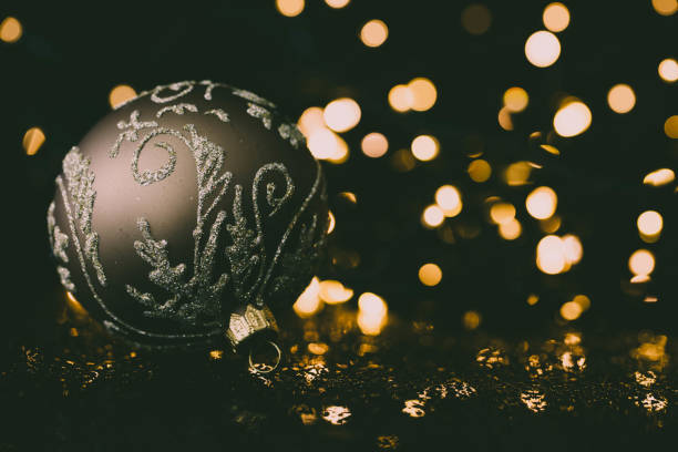 istock Shiny christmas ornament with christmas lights. 866518098