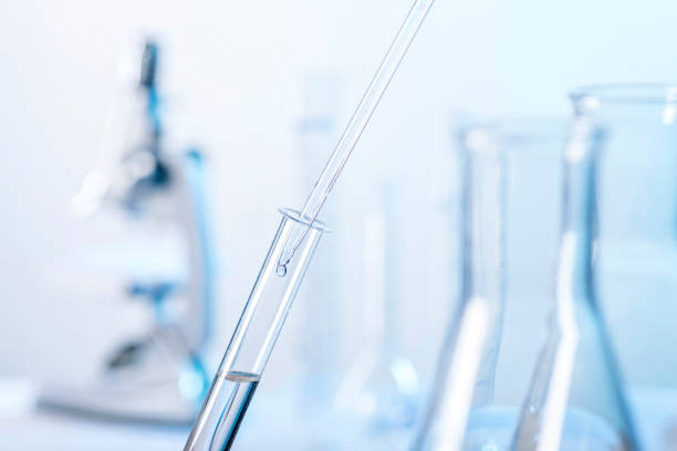 Laboratory scene with pipette and test tube Active ingredient is dripped into a reagent glass with a pipette scientific exploration stock pictures, royalty-free photos & images